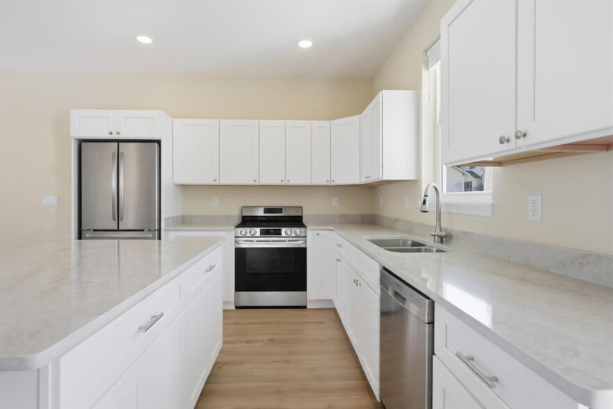 Taj Mahal countertops and stainless appliances - Casablanca Condos