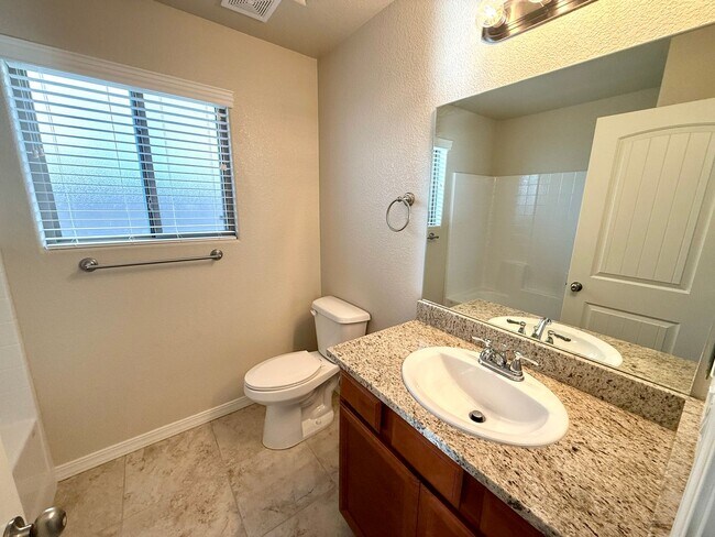 Building Photo - Great 4 Bedroom Home with Drive Through Side Gate!