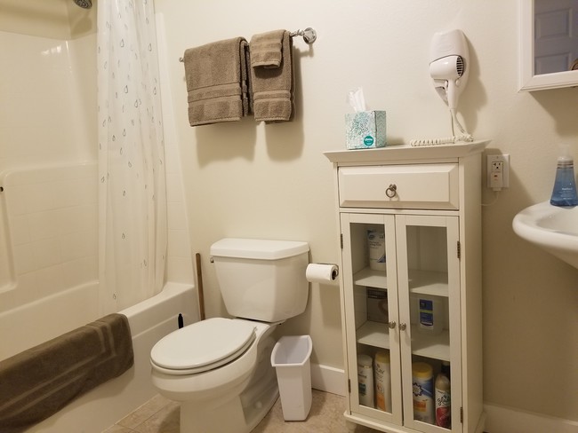 Full size bathroom with bathtub - 8855 39th Ave SW