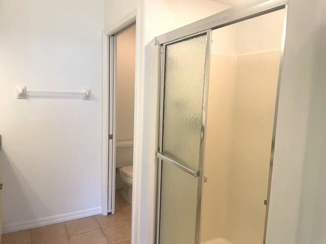 Building Photo - Elegant 3 Bedroom End-Unit Condo with Screened Lanai & Pond Views and A Private Garage
