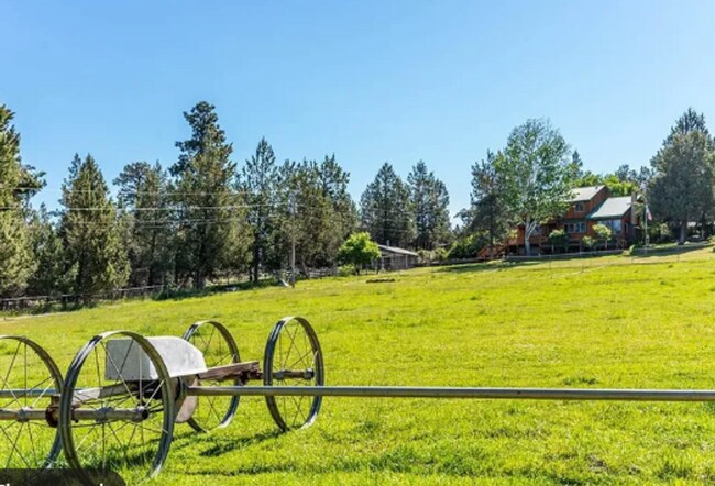 Building Photo - Custom Rustic 4-Bdr on beautiful 5 acres with Greenhouse in Sisters!