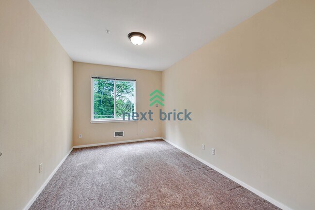 Building Photo - Rare Ground-Floor, End Unit with massive b...