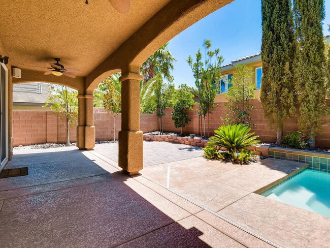 Building Photo - LUXURIOUS UPGRADED HOME IN A GATED SUMMERLIN AREA!!HOUSE HAS POOL AND SPA AND PATIO COVERED BACKY...