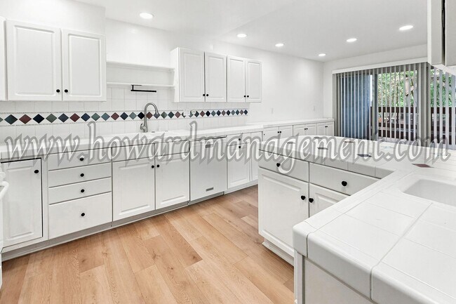 Building Photo - LAKE VIEW in LA! Majestic townhouse with high ceilings, three patios and lake view!
