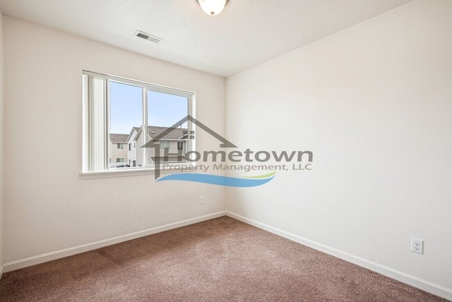 Building Photo - Townhouse Style Home with 3 Bedrooms, 2.5 Bathrooms, and a 2-Car Attached Garage Available in Coe...