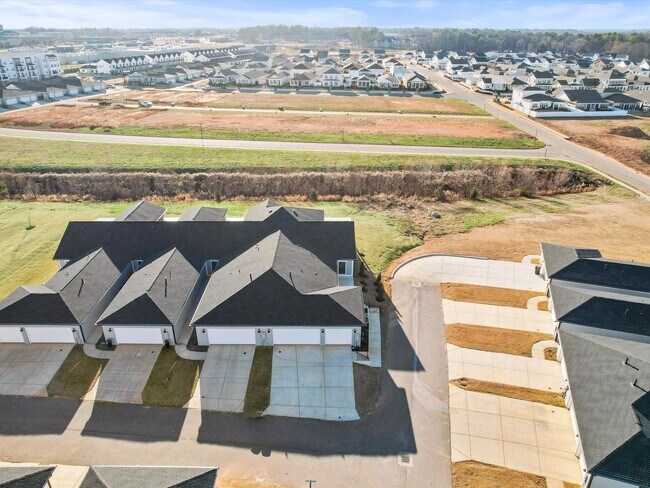 Building Photo - 3 Car Garage! Modern end-unit townhome located in the desirable Clift Farm!