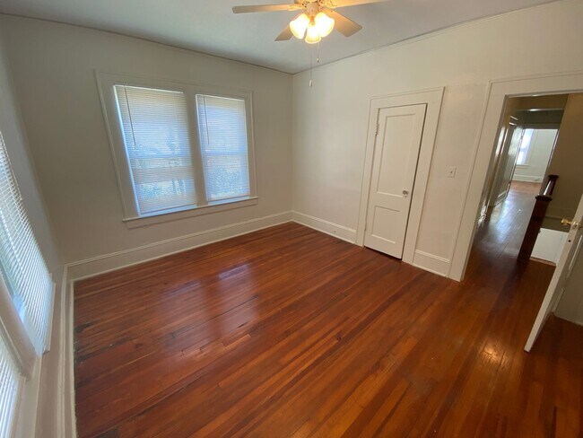 Building Photo - 1,550 square feet in Trinity Park. High ceilings, French doors, and a porch worth sitting on.