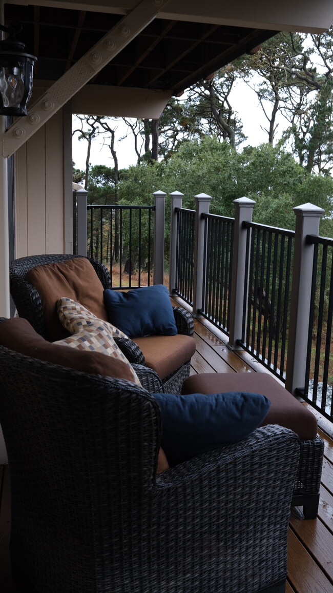 Back porch with ocean and forest views - 250 Forest Ridge