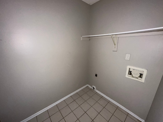 Building Photo - Charming 3BR/2BA Near Southwind | Soaring Vaulted Ceilings, Rustic Fireplace & Garage