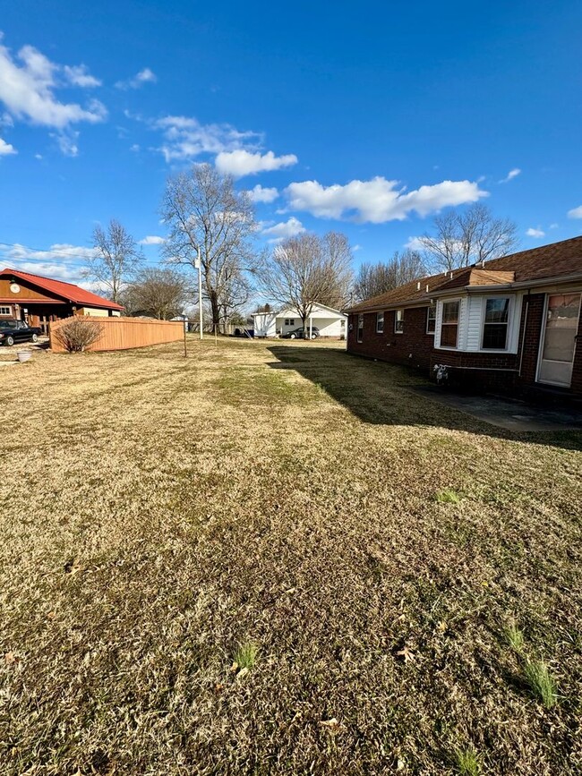 Building Photo - Well maintained brick home on a nice corne...