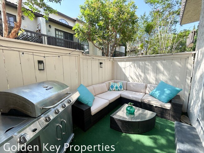 Building Photo - Welcome to this stunning ***unfurnished*** tri-level condo in the desirable Casitas de la Costa c...