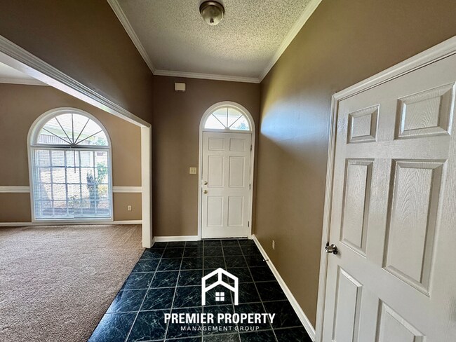 Building Photo - Spacious 3BR/2BA Near Southwind | 1,958 Sq Ft, Brick Fireplace, 2-Car Garage & Quiet Cove