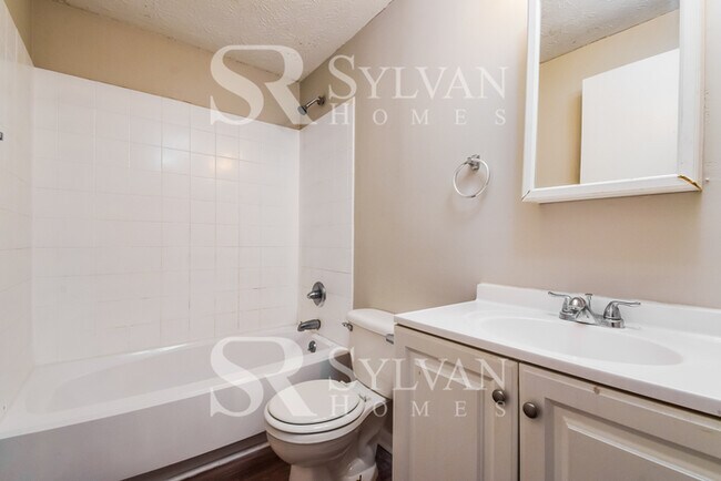 Building Photo - The living is easy in this 4 bedroom, 2 ba...