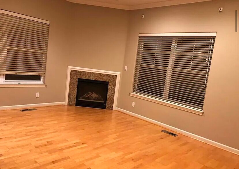 spacious bedroom w/high ceilings and electric firecan fit any size bed, desk, furniture comfortably - 373 Florence St