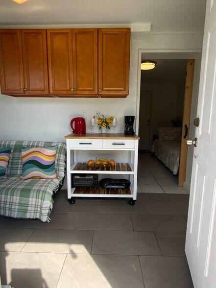Entrance to 2x1 2 room with twin long bed /washer and dryer area. - 2440 Manasota Beach Rd