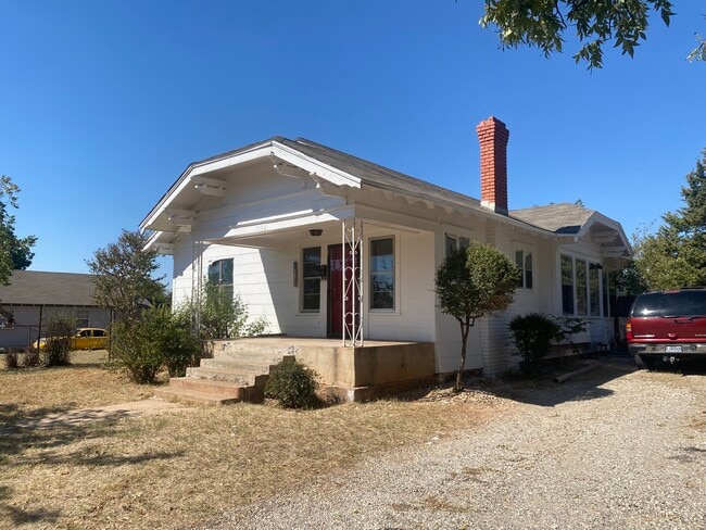 Front of 1208 Fillmore showing parking place. Room for 3 cars beside the house. - 1208 Fillmore St