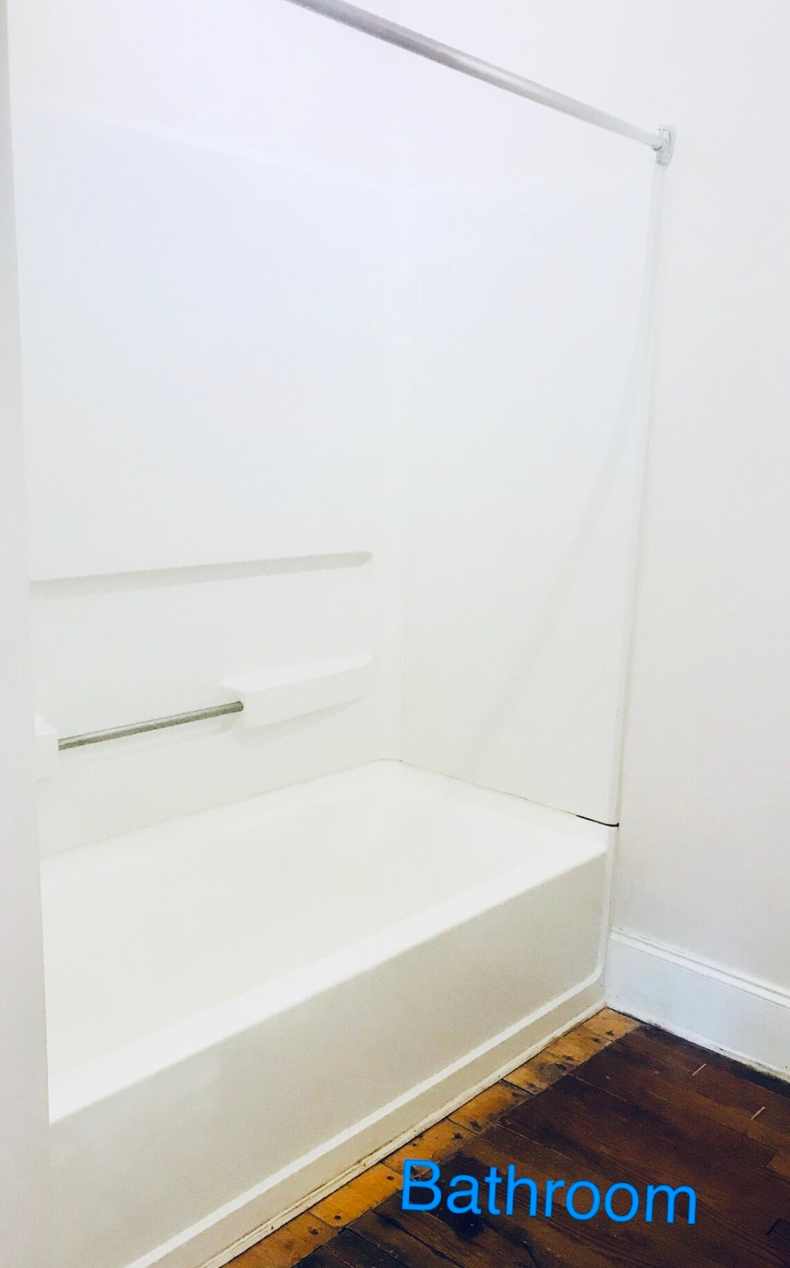 Full bathroom with tub, curved glass enclosure, and plenty of built-in storage space. - 1937 Fairfield Dr