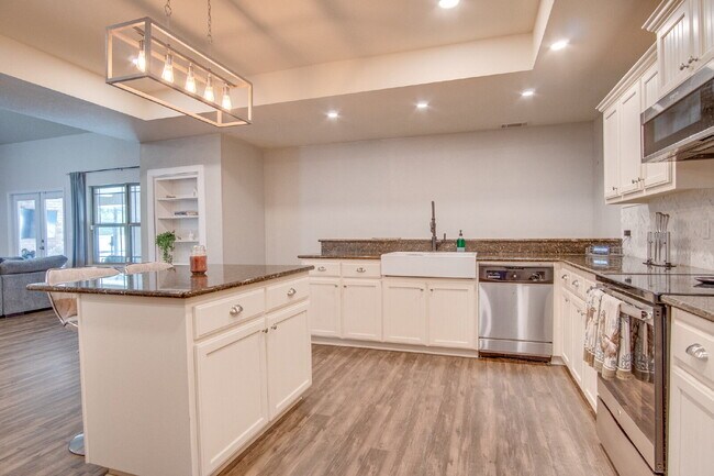 Building Photo - Milton 4BR Pool Home with Office, Vaulted Ceilings, Screened Saltwater Pool & 2-Car Garage