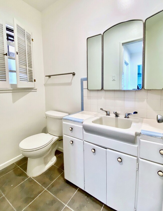 Convenient powder room on upper level. - 1672 Rotary Dr