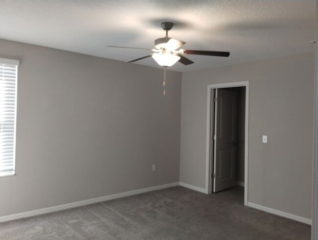 Building Photo - 4-bedroom, 2.5-bath home offering 1,881 square feet of comfortable living.