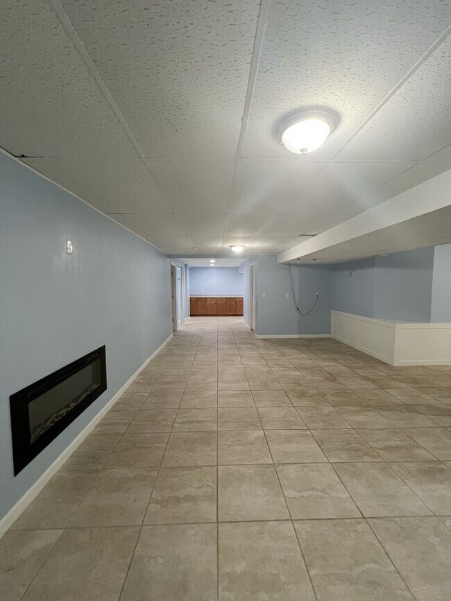 Building Photo - SEE IT NOW: Spacious 4-Bed Home with Finis...