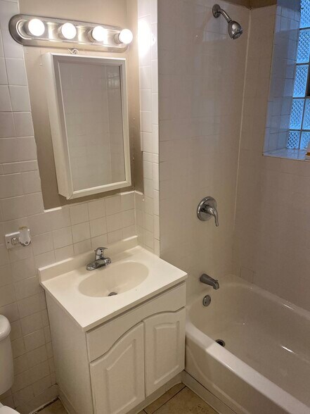 Bathroom with Tub & shower - 7948 S Drexel Ave