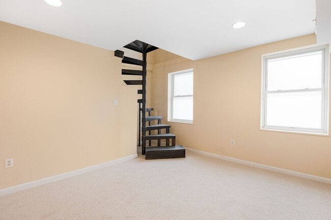 Building Photo - Spacious 2BR/2.5BA Townhome with Finished Basement & Extra Storage