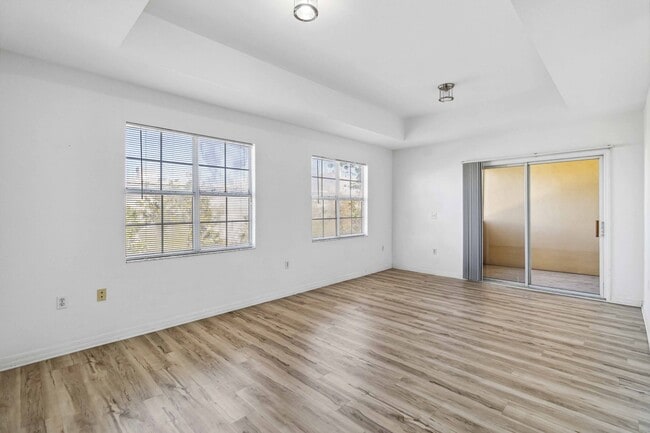 Building Photo - Spacious 1-Bedroom Condo for Annual Rent available now in gated Villagio Community