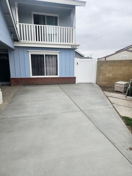 Parking area located on pad in front of big house. - 7431 Warren Cir