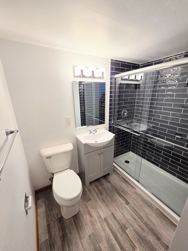 New walk-in shower - Madison Square Apartments
