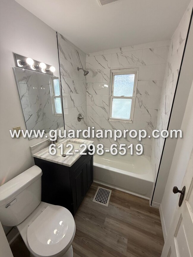 Building Photo - House Close to U of M Available Now, Hardwood Floors, Remodeled Bathroom, 2 Car Garage