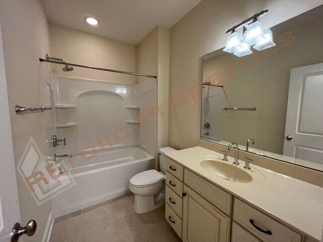 Building Photo - Elegant 3 Story 3 Bedroom Formal Model Tow...