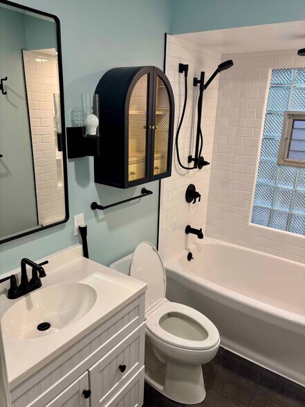 Bathroom - new cabinet and fixtures - 3276 S Lenox St