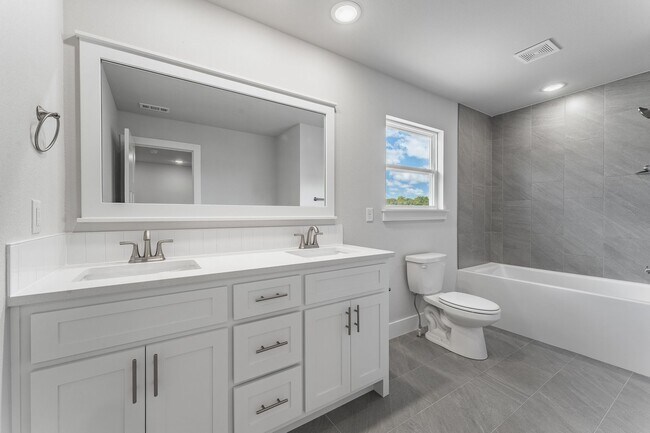 Building Photo - Modern Elegance: Spacious 4-Bedroom New Bu...