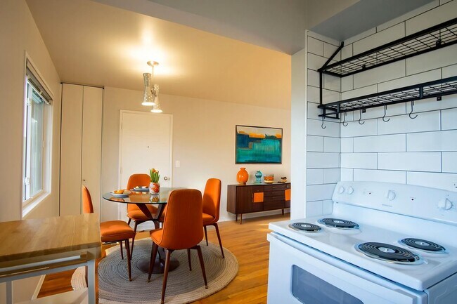 Building Photo - FOUR WEEKS FREE! Renovated Mid-Century 2Bdr w/Hardwoods, Dishwasher + Pets OK