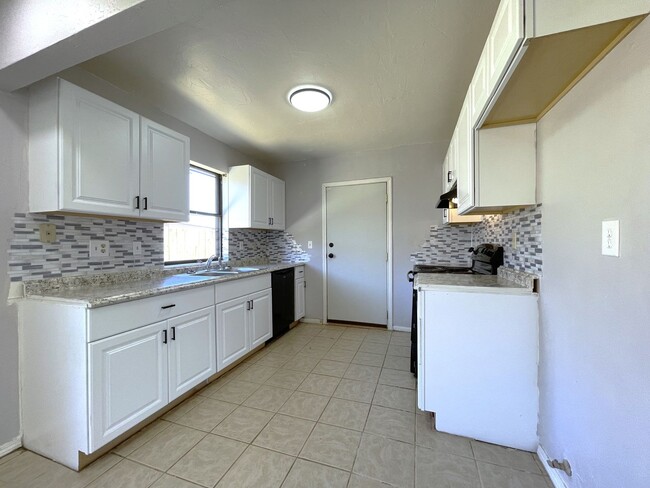 Building Photo - Welcome to this charming two-story single-...
