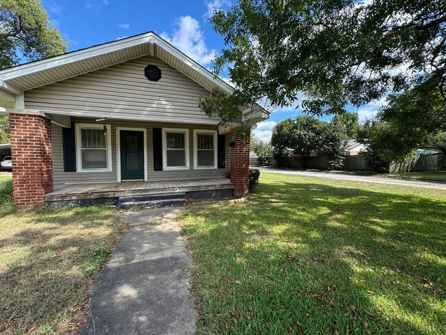 Building Photo - Three bedroom two bath home with central heat and air, large fenced backyard, and carport!