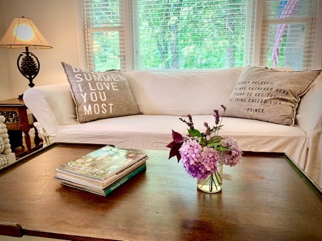 Living room is bright and airy with a large picture window overlooking a large wooded private road. - 12159 Spruce St