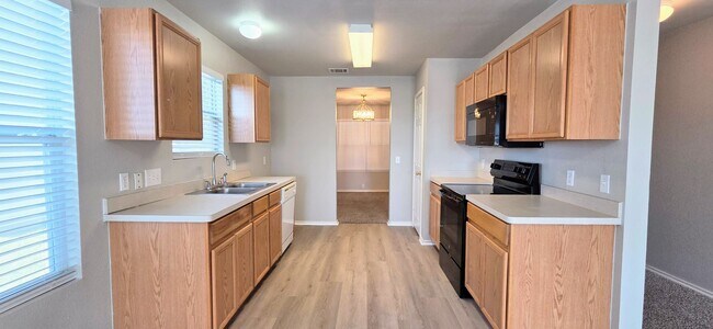 Building Photo - Rare 5 Bedroom Home Available for Immediate Move In w/downstairs Master Bedroom