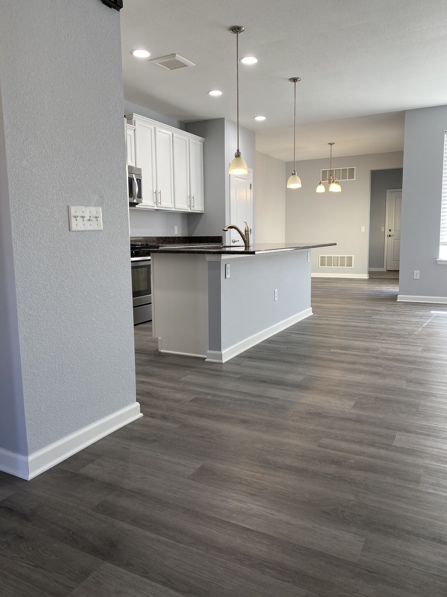 Kitchen view from front door entry - 16155 W 62nd Ln