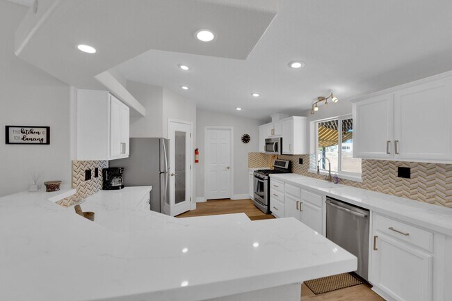 Building Photo - Single-Level Living with Giant Garage & Ba...