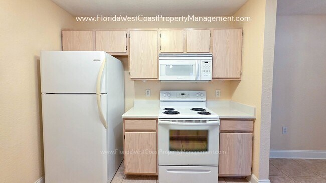 Building Photo - MOVE IN READY! LARGE 2 BEDROOM/2 BATH PLUS ATTACHED GARAGE! TILE/LVP THROUGHOUT!