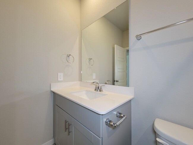 Building Photo - Single-story layout features a bright, open concept living area, dining space, and kitchen. Pebbl...