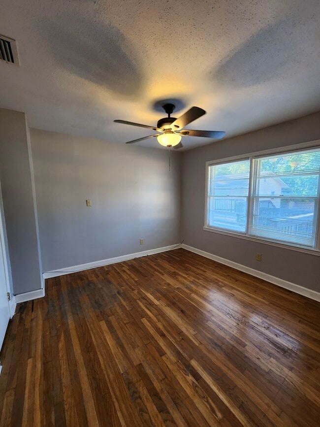 Building Photo - Spacious 4BR/2BA Brick Home with Fireplace, Large Island!