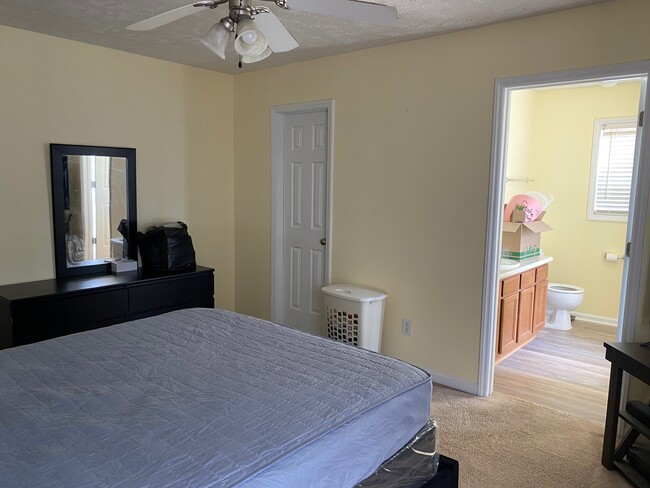 Master bedroom, looking toward walk-in closet and into Master 5 piece bath - 1487 Oldstead Dr