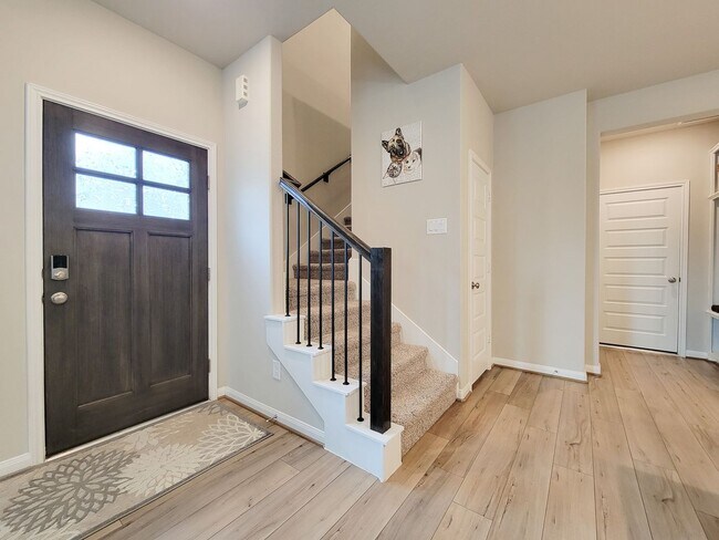 Building Photo - A true gem on a quiet corner lot, this spacious and sun-filled home is tucked away from street no...