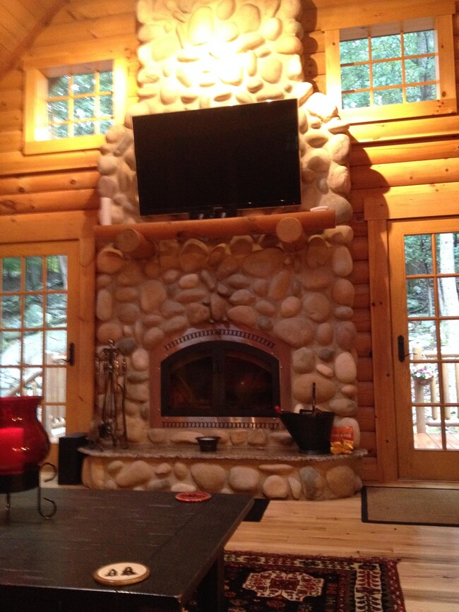 Stone fireplace equipped with a heat recirculating system to save on heating costs! - 135 Song Mountain Dr