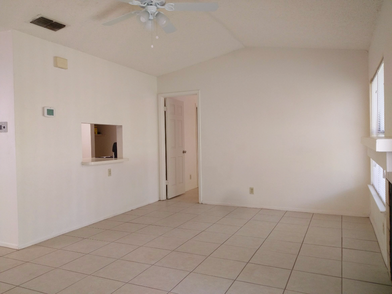 Living Room with Kitchen Pass-Through/Breakfast Bar to Master Bedroom entrance - 2521 Corian Glen Dr