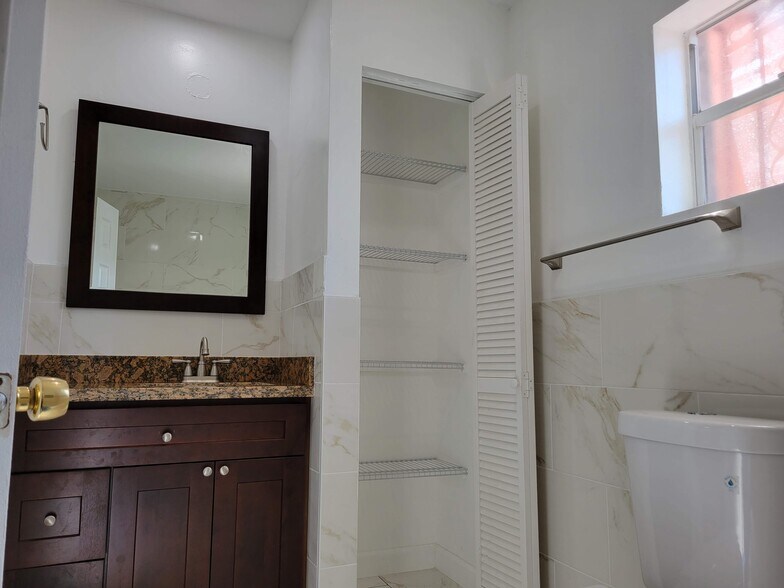 Bathroom vanity and linen closet - 1646 NE 150th ST