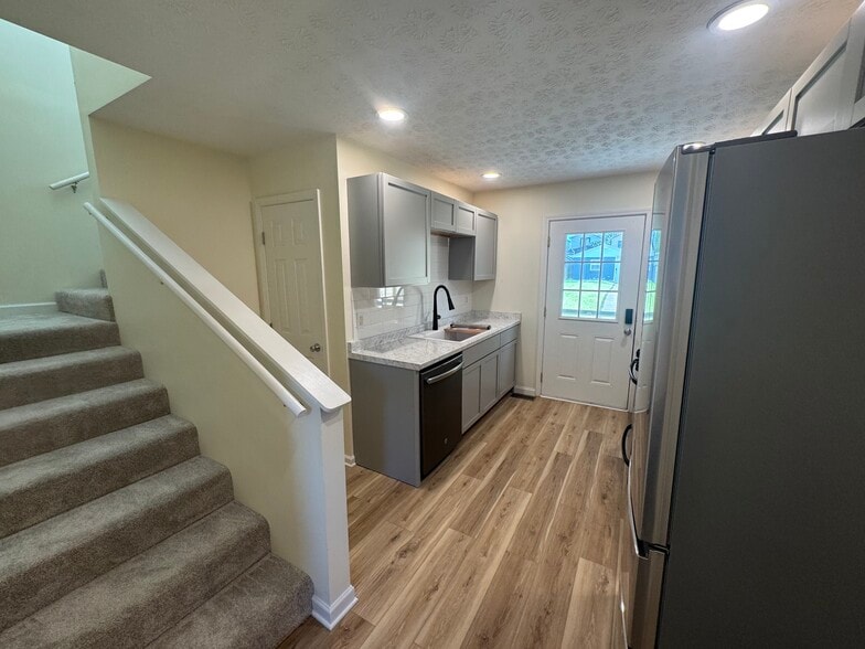 Kitchen and stairs to second floor - 1221 Payne St